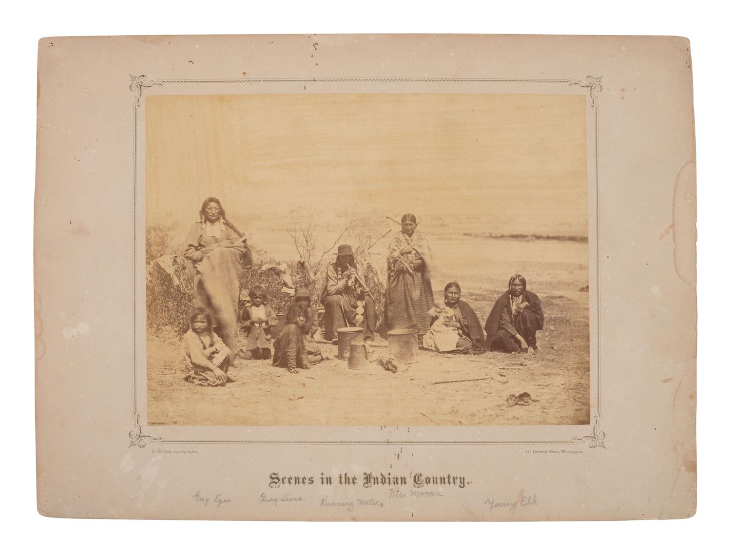 GARDNER, Alexander (1821-1882), photographer. Albumen photograph of Grey Eyes, Running Water, Mrs. Mora, Young Elk, and others at Fort Laramie. 1868.
