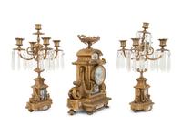 A Napoleon III Style Gilt Bronze and Sèvres Style Porcelain Clock Garniture