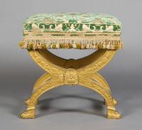A Neoclassical Curule Form Giltwood Bench, Height 22 1/2 inches.