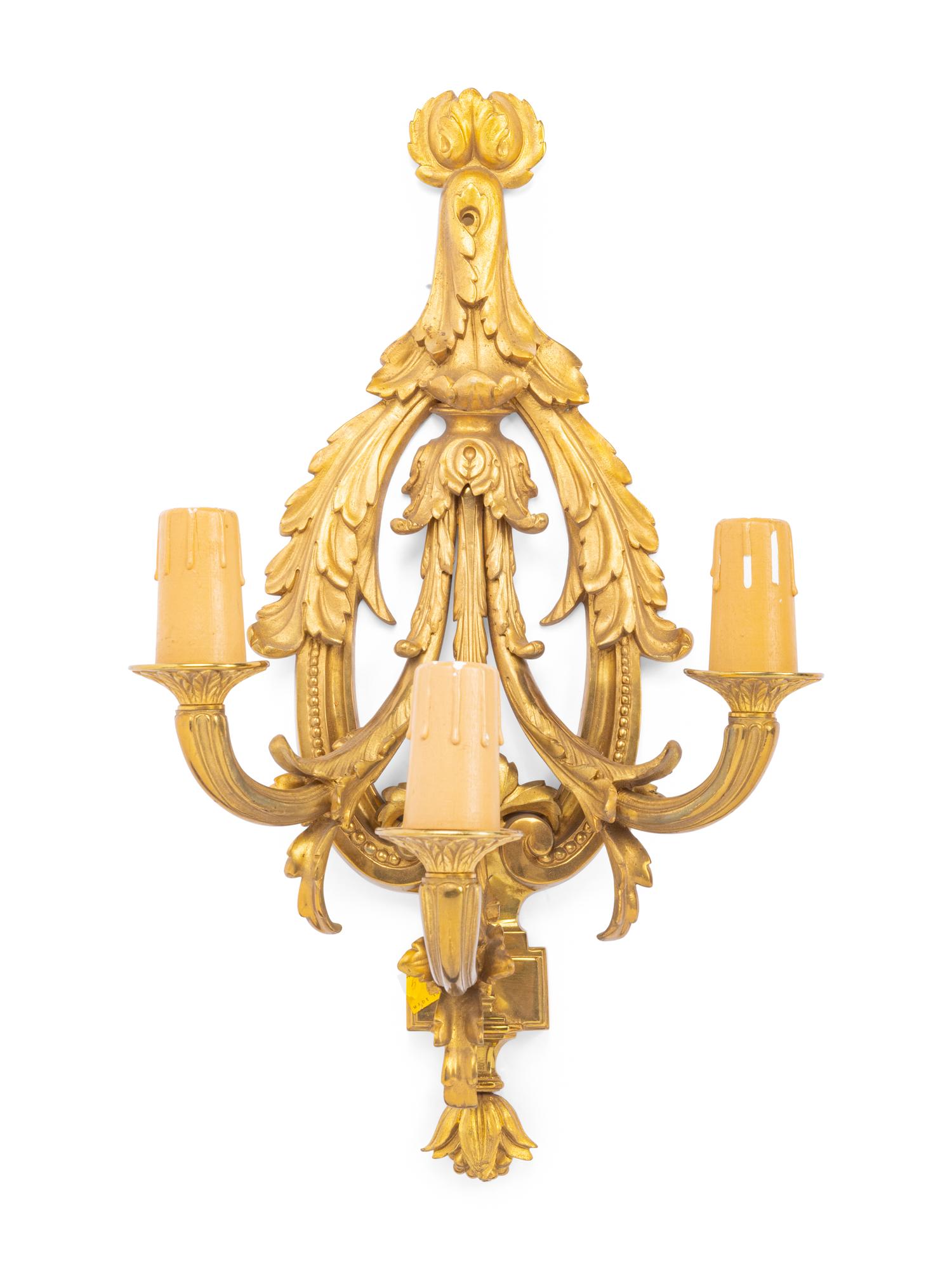 A Set of Four Louis XVI Style Gilt Metal Three-Light Sconces