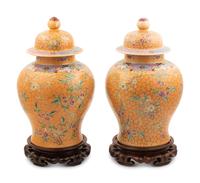 A Pair of Chinese Ochre Ground Famille Rose Porcelain Covered Jars