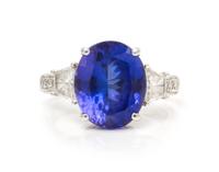 An 18 Karat White Gold, Tanzanite and Diamond Ring, 4.30 dwts.