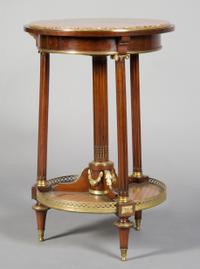 A French Gilt Metal Mounted Gueridon, Height 29 1/2 x diameter 19 1/2 inches.