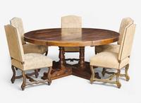 A Baroque style circular pine dining table together with a set of five Baroque style upholstered wood dining chairs, modern