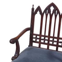 A Gothic Revival Style Carved Oak Armchair