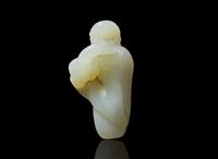 A small Chinese carved pale celadon jade figure of a foreigner 青白玉雕胡人