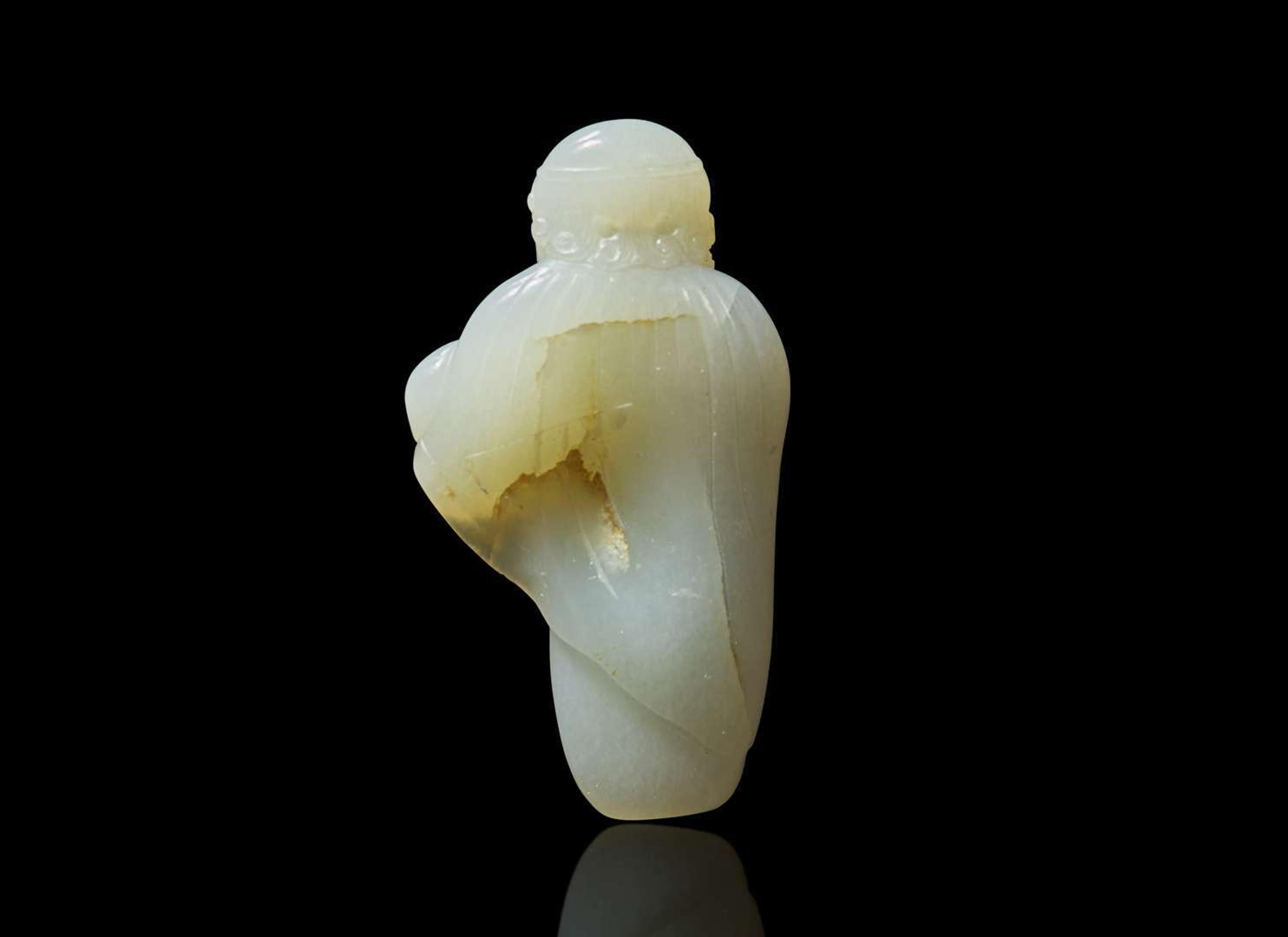 A small Chinese carved pale celadon jade figure of a foreigner 青白玉雕胡人