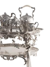 A Rare German Silver Two-Tier Tea Table with Matching Five-Piece Tea Service and Two Trays