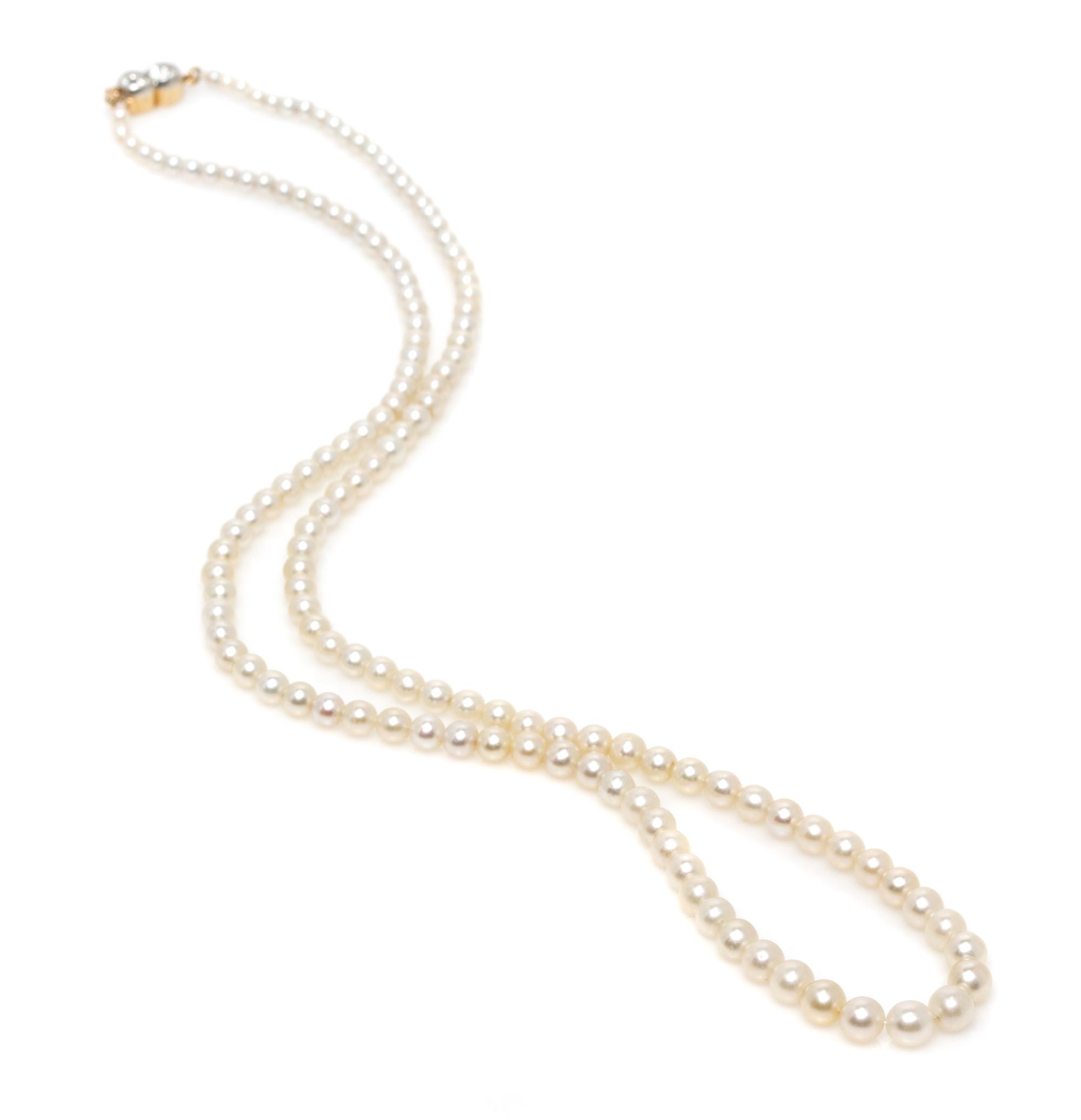 A Graduated Single Strand Natural Pearl Necklace,