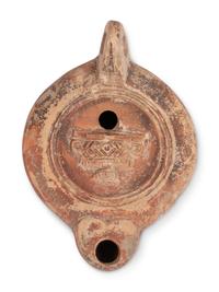 Ten Roman Terracotta Oil Lamps and a Holy Land Pottery Jug