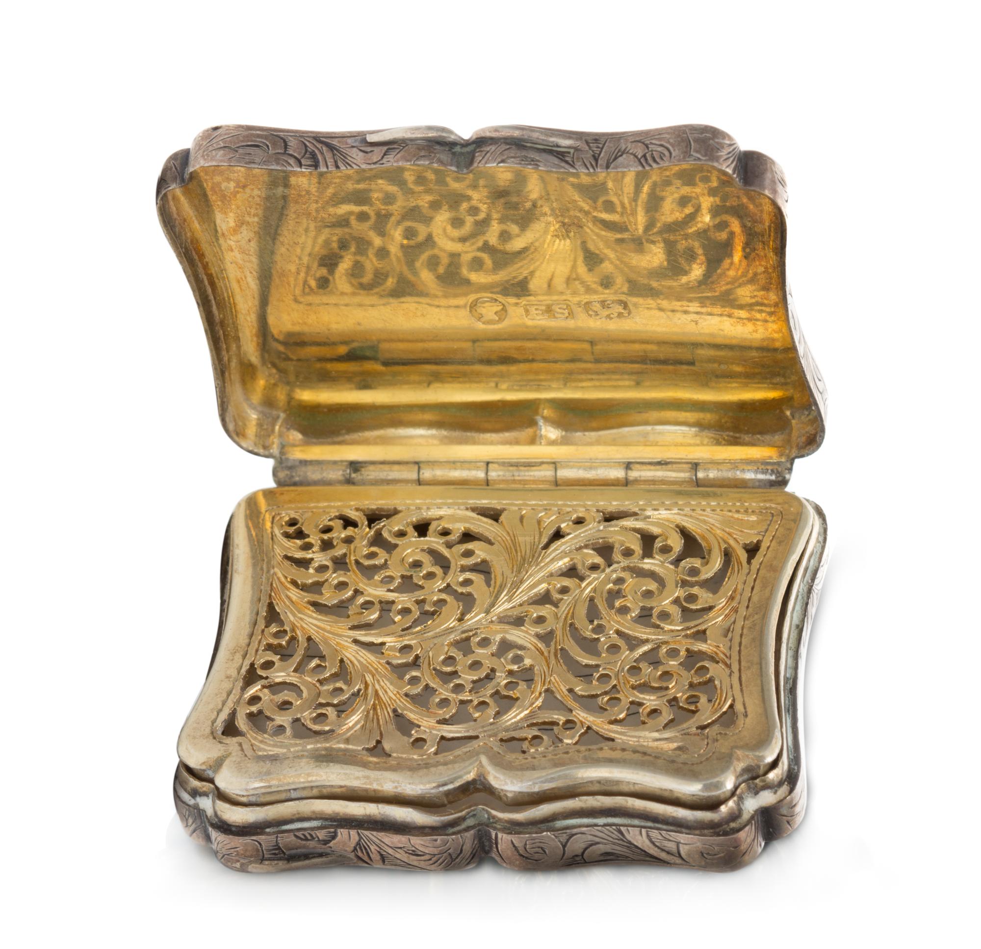 A Victorian Silver Vinaigrette, Edward Smith, Birmingham, 1844, the lid decorated with a pastoral scene, the case with floral and folia