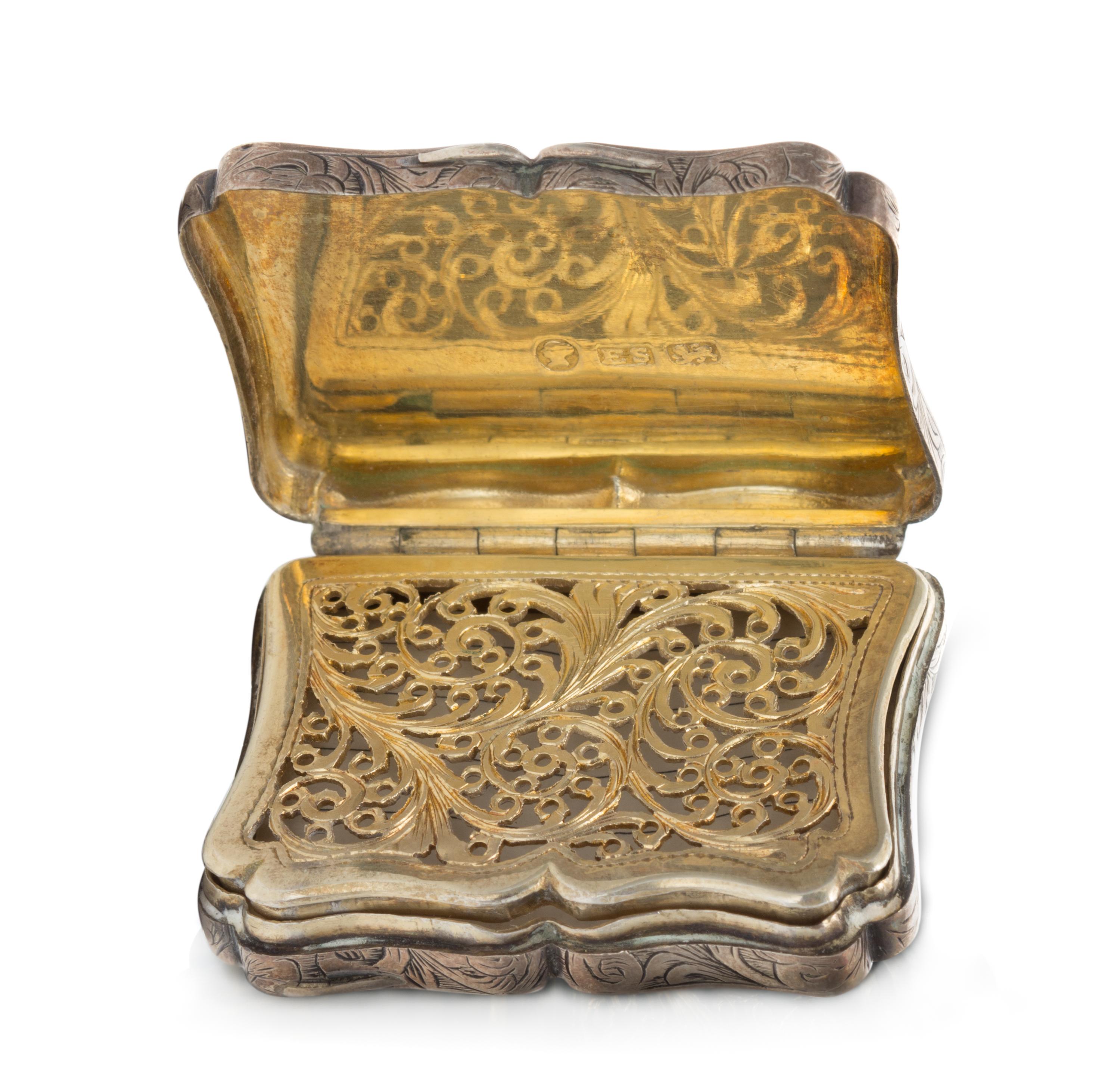 A Victorian Silver Vinaigrette, Edward Smith, Birmingham, 1844, the lid decorated with a pastoral scene, the case with floral and folia