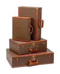 A Group of Four Louis Vuitton Hard-Sided Suitcases