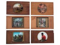 [CIVIL WAR - MAGIC LANTERN SLIDES]. A collection of magic lantern slides depicting enslaved people, Civil War battles, and caricatures, including: