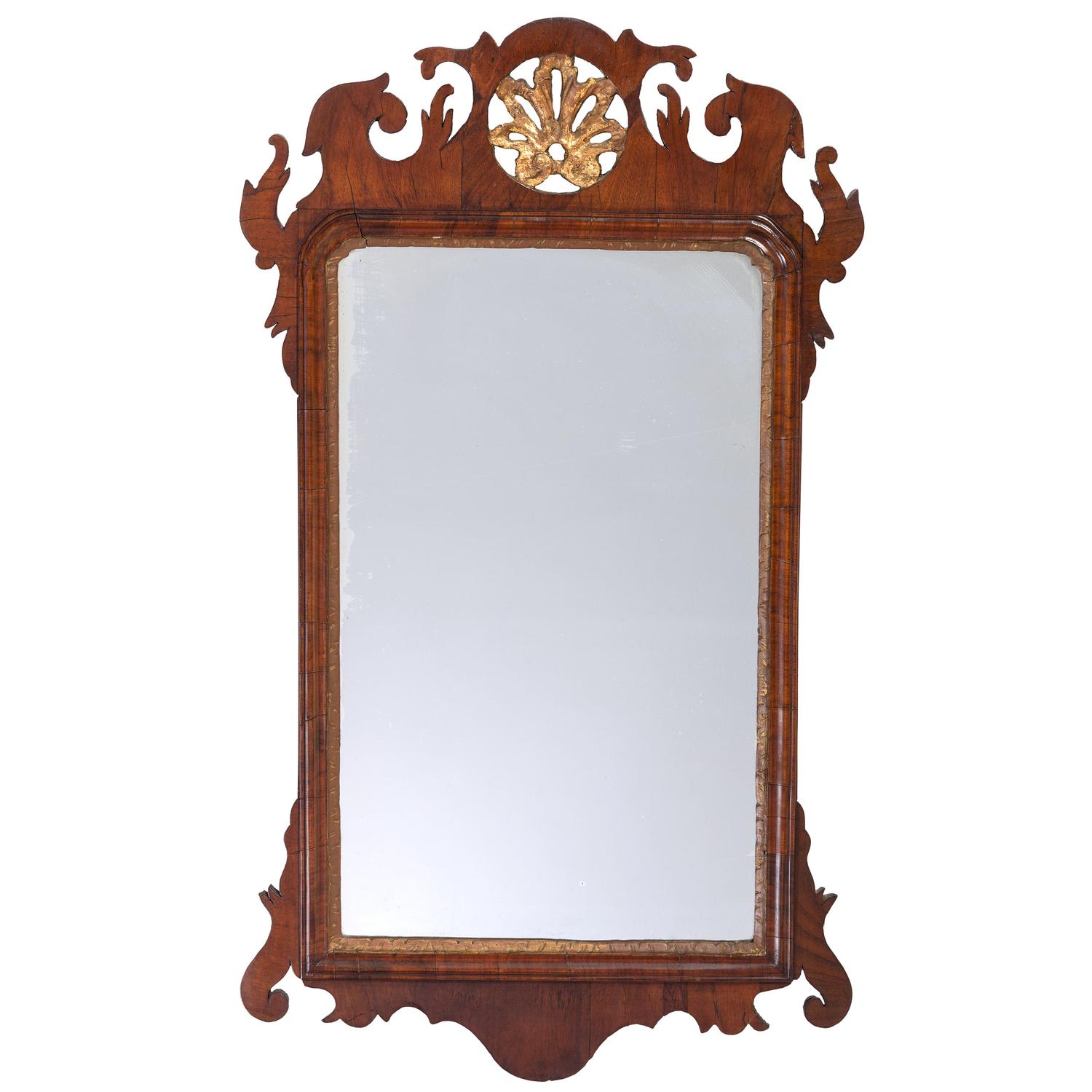 A Chippendale Parcel Gilt and Carved Mahogany Looking Glass