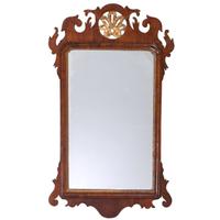 A Chippendale Parcel Gilt and Carved Mahogany Looking Glass