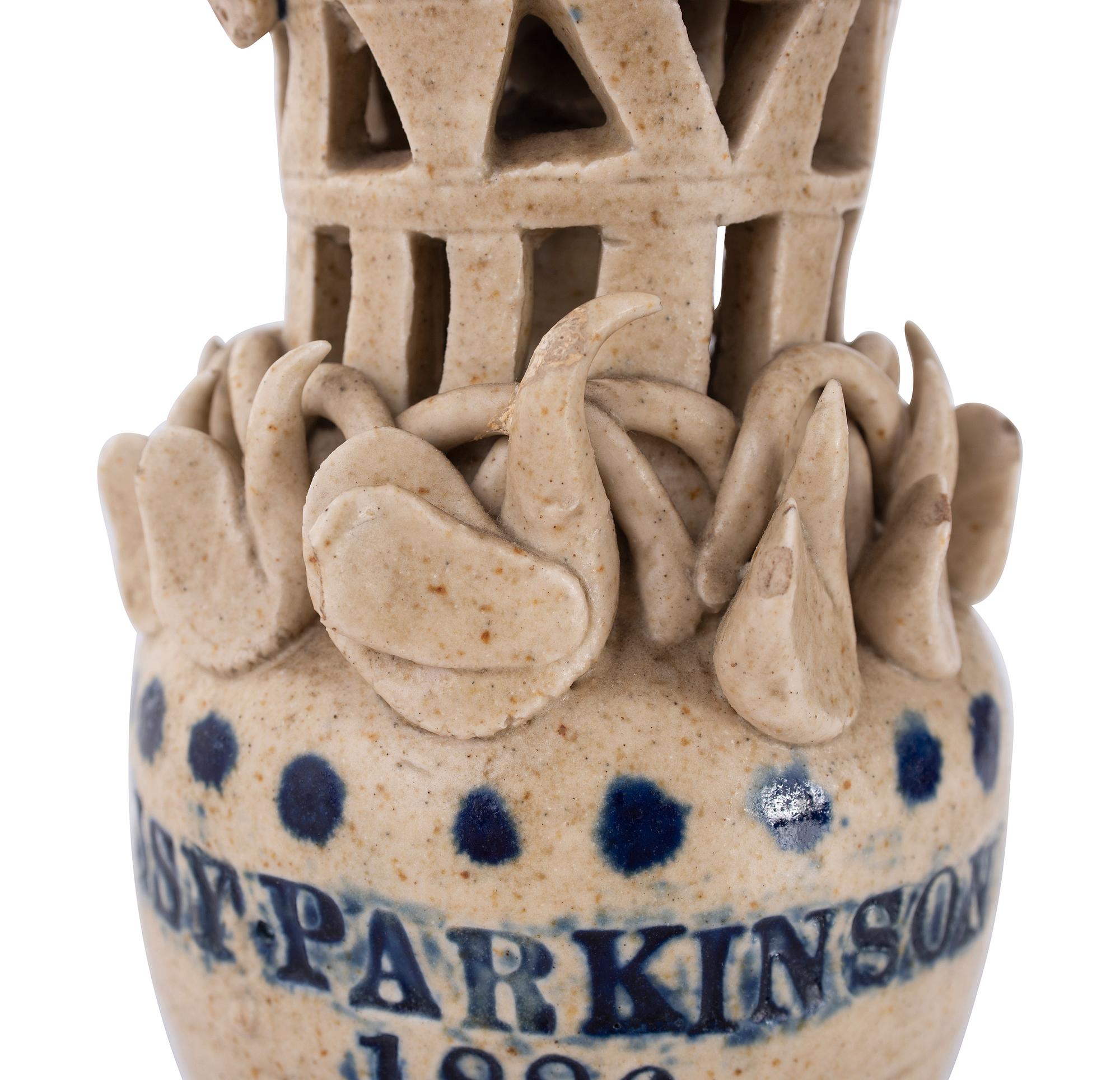 A Pair of Cobalt Decorated Stoneware Puzzle Banks