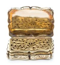 A Victorian Silver-Gilt Vinaigrette, Nathaniel Mills, Birmingham, 1843, the case decorated with foliate volutes, the lid centered by a
