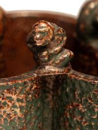 A Glazed Sewer Tile Trefoil Vase or Planter with Seated Monkeys