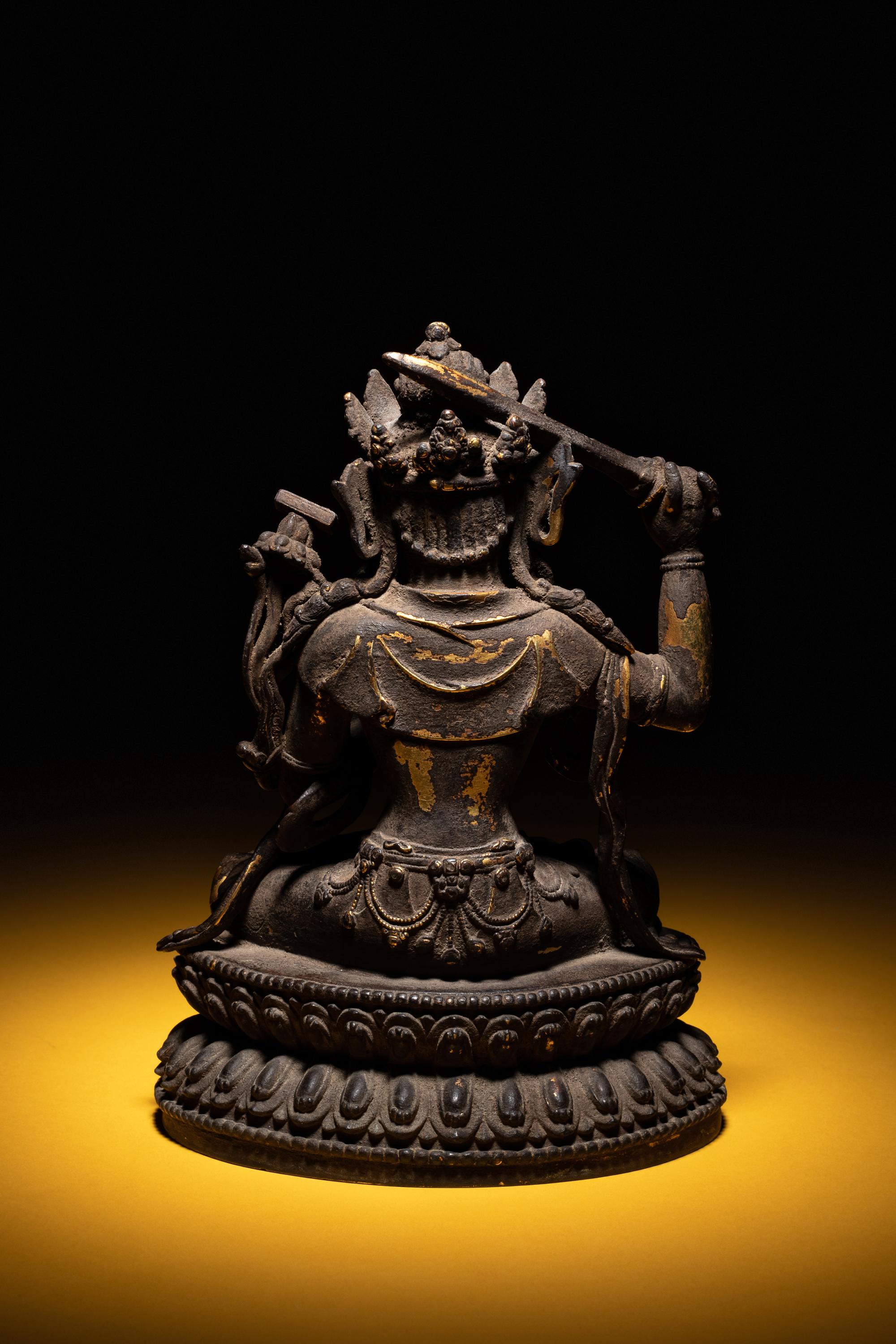 A Sino-Tibetan Parcel-Gilt Bronze Figure of Manjushri
