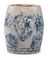 A Cobalt-Decorated Molded Stoneware Water Cooler with Bear Decoration