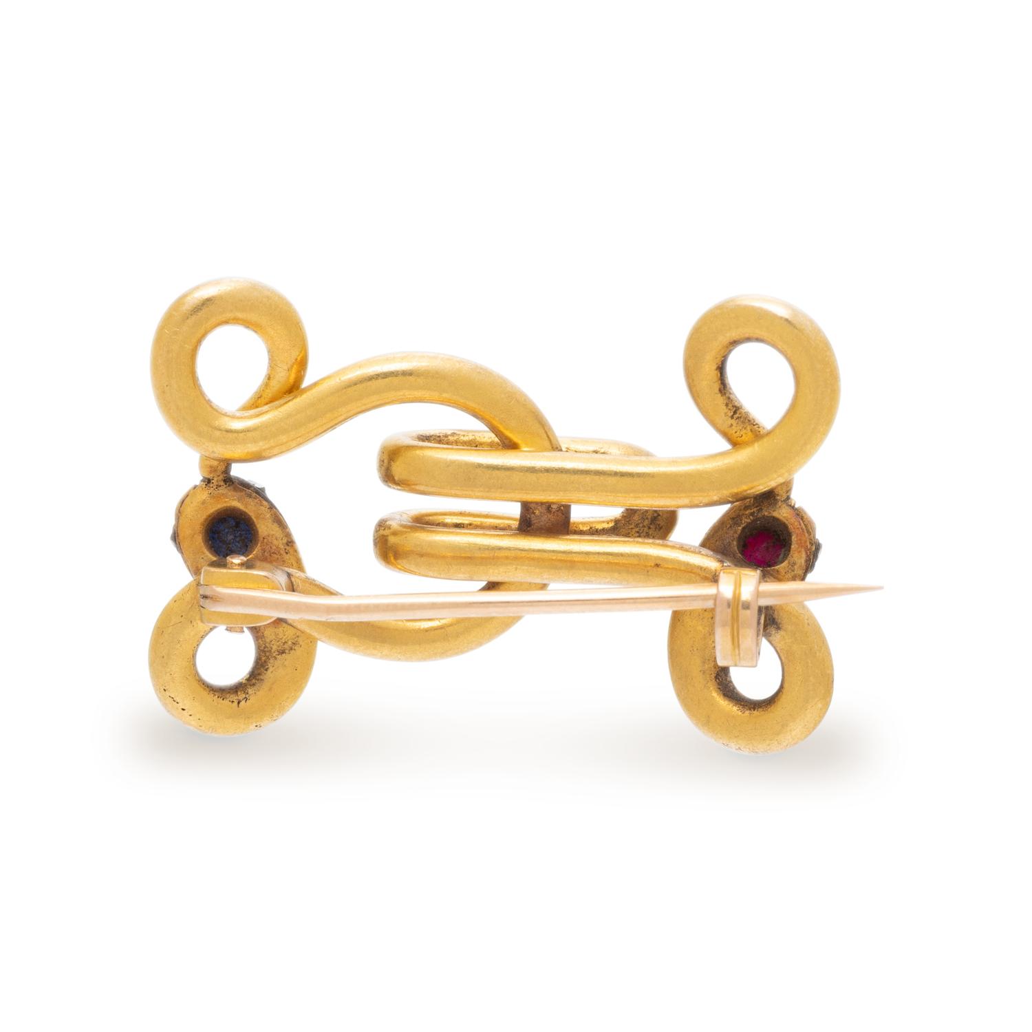 FRENCH, SAPPHIRE, RUBY, DIAMOND, AND YELLOW GOLD DOUBLE SNAKE OUROBOROS BROOCH