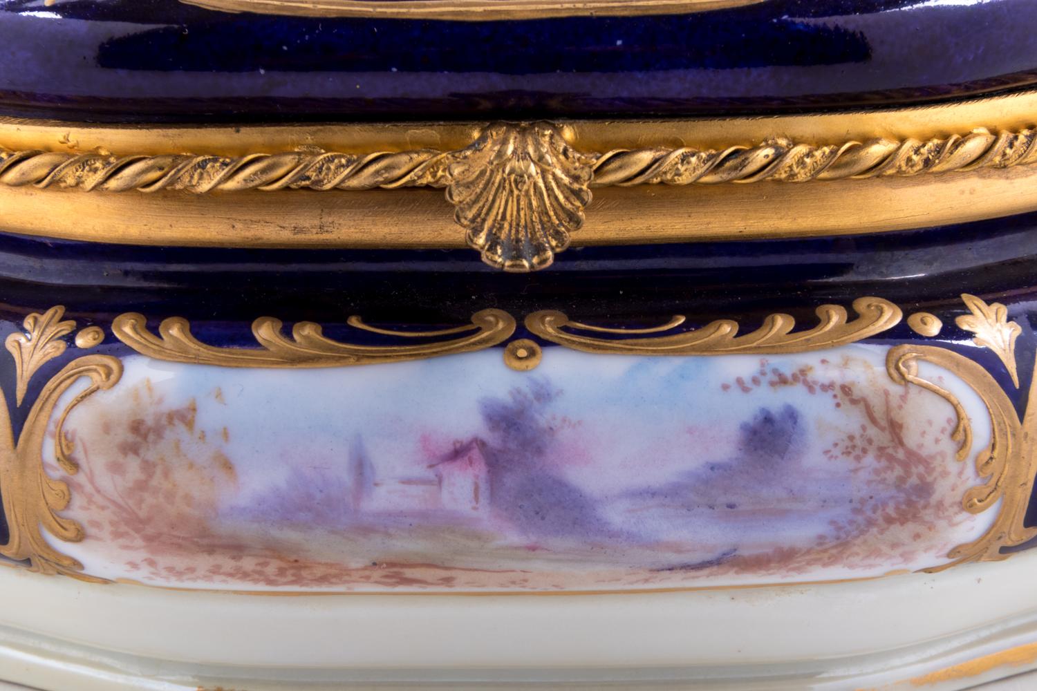 A Sèvres Style Painted and Parcel Gilt Porcelain Table Casket