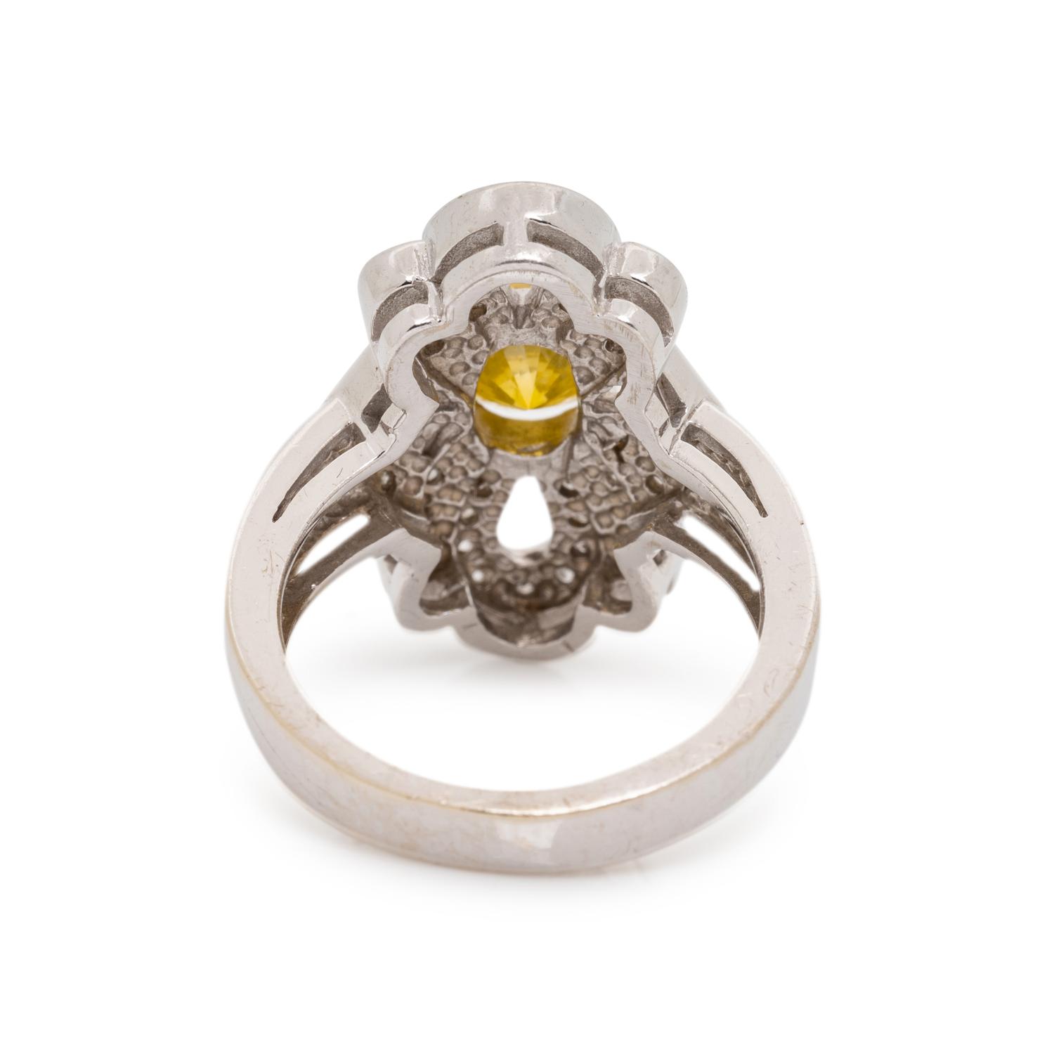 WHITE GOLD, TREATED YELLOW DIAMOND AND DIAMOND RING