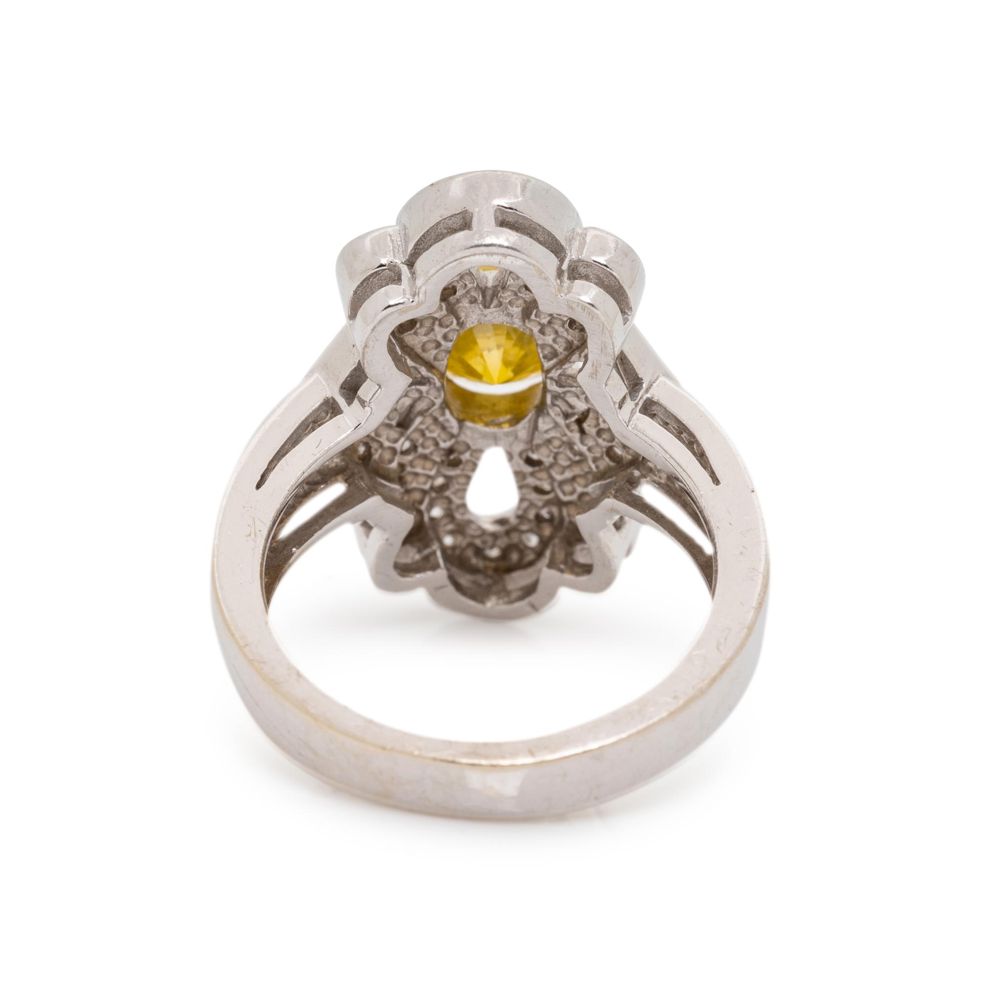 WHITE GOLD, TREATED YELLOW DIAMOND AND DIAMOND RING