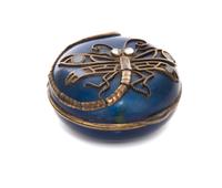 A Russian Silvered Metal Mounted Lacquered Box, Early 20th Century, of circular hinged form, the lid set with a dragonfly.