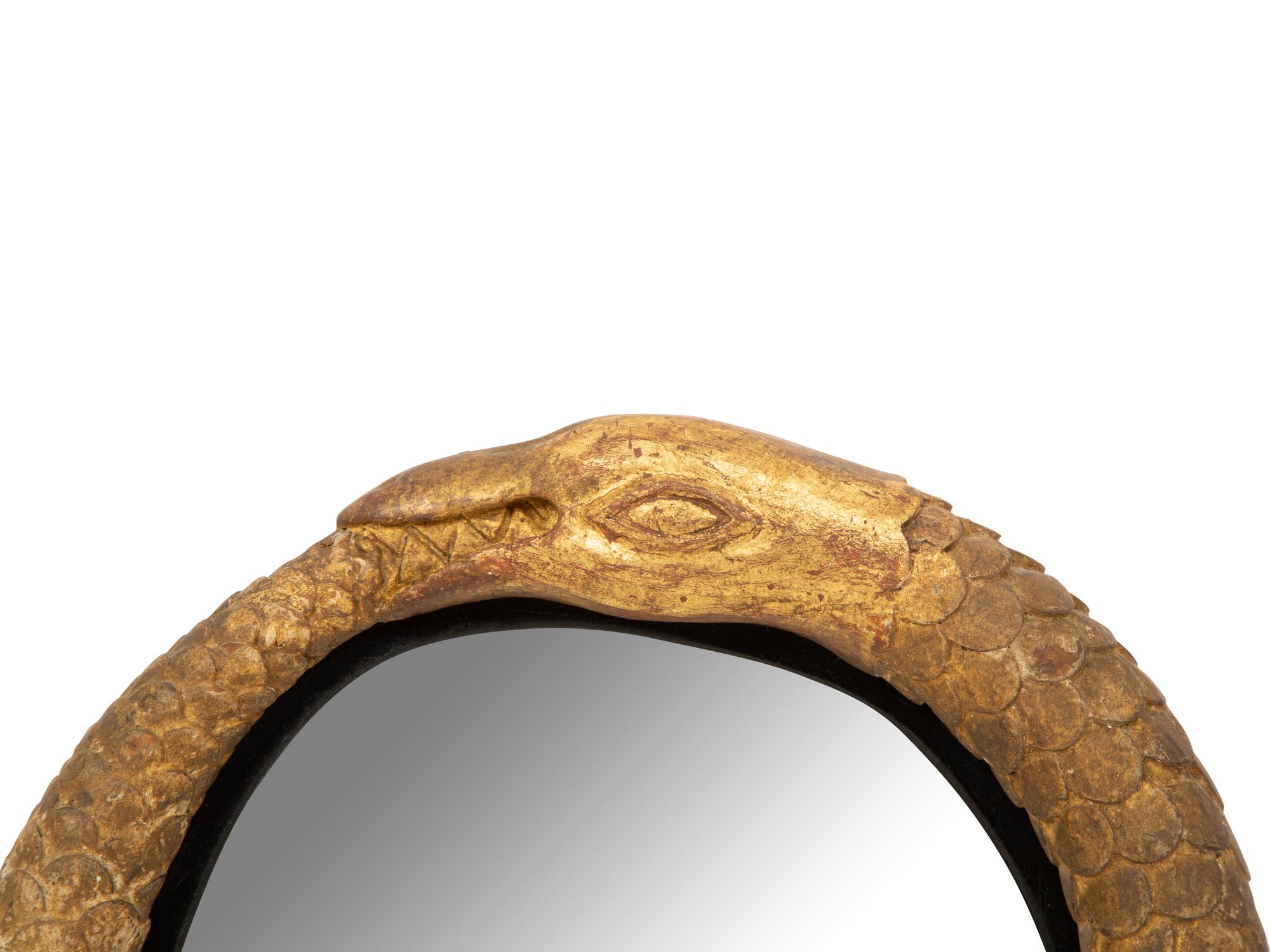 A Pair of Giltwood Snake Motif Mirrors