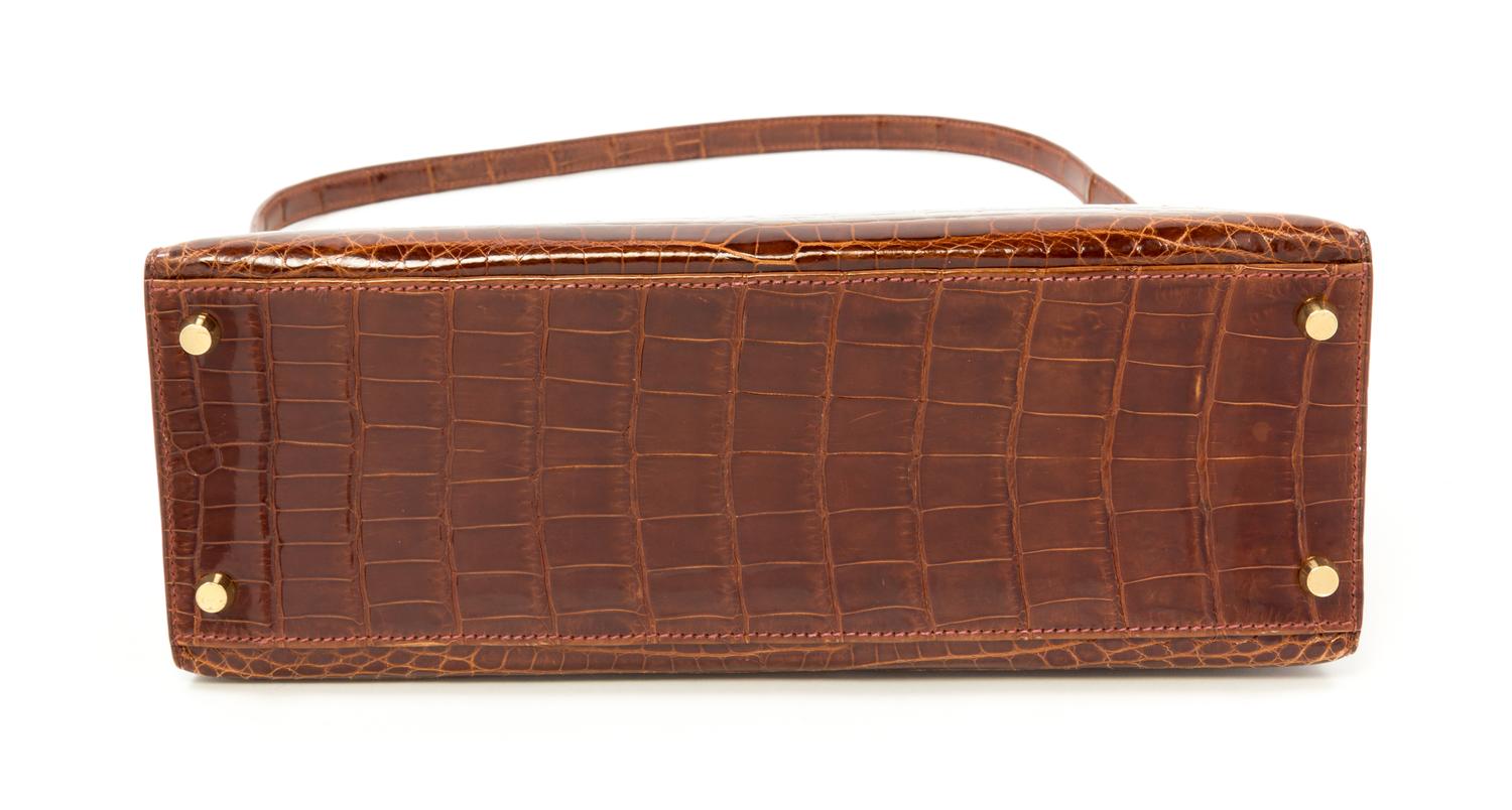 An Hermès Brown Niloticus Crocodile Sellier 32cm Kelly Handbag, 12.5" x 5" x 9.5"; Handle drop: 3.25".