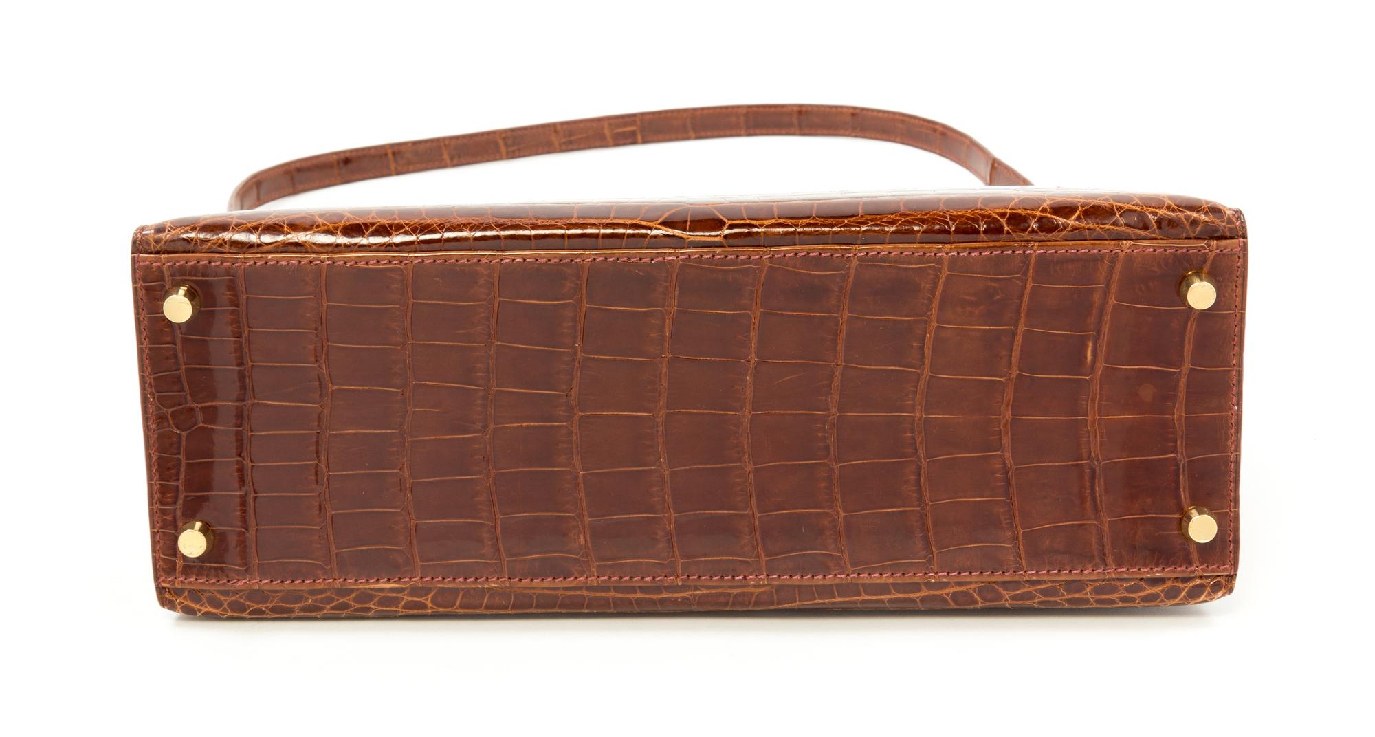 An Hermès Brown Niloticus Crocodile Sellier 32cm Kelly Handbag, 12.5" x 5" x 9.5"; Handle drop: 3.25".