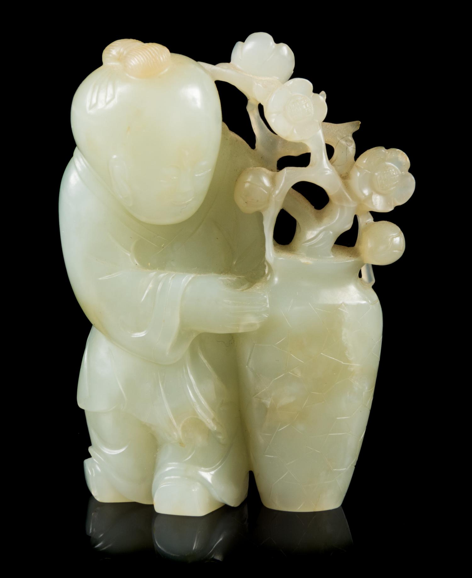 A Carved Celadon Jade Figure of a Boy Height 2 3/4 inches. — 19TH CENTURY