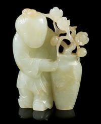 A Carved Celadon Jade Figure of a Boy Height 2 3/4 inches. — 19TH CENTURY