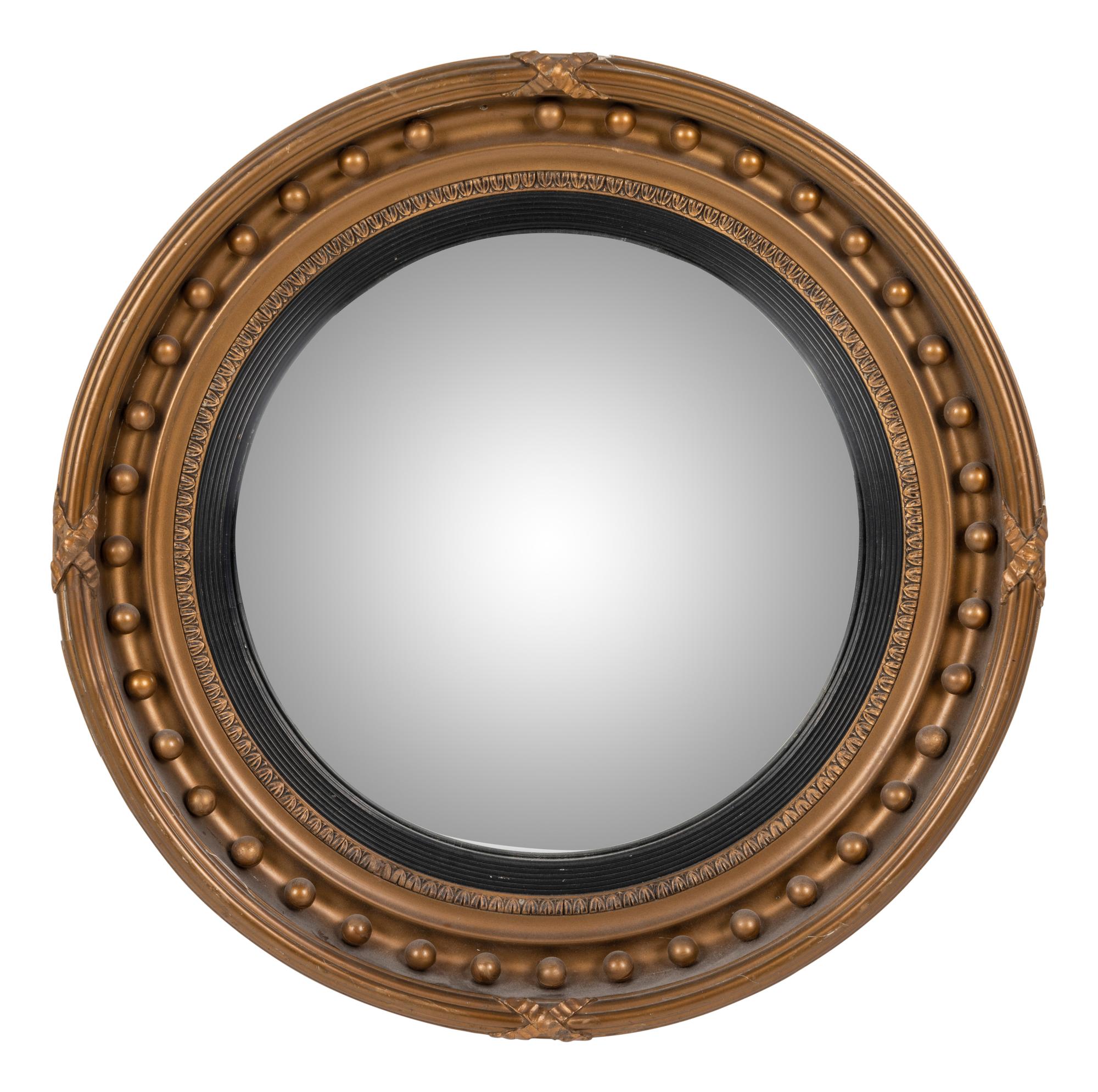 A Regency Giltwood and Ebonized Convex Mirror
