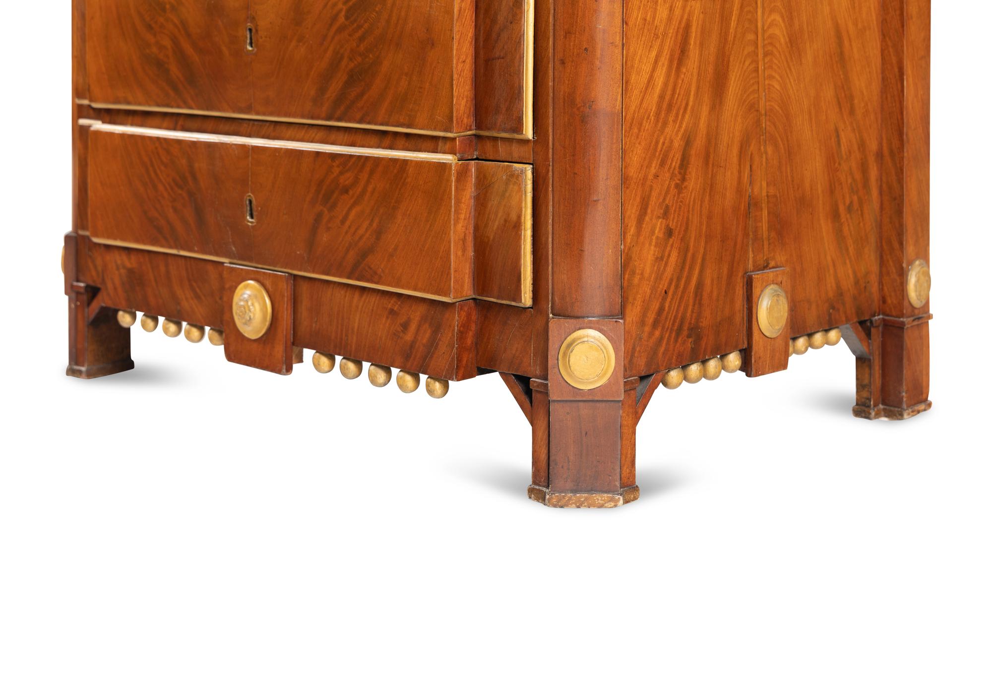 A Baltic Style Parcel Gilt Mahogany Chest of Drawers