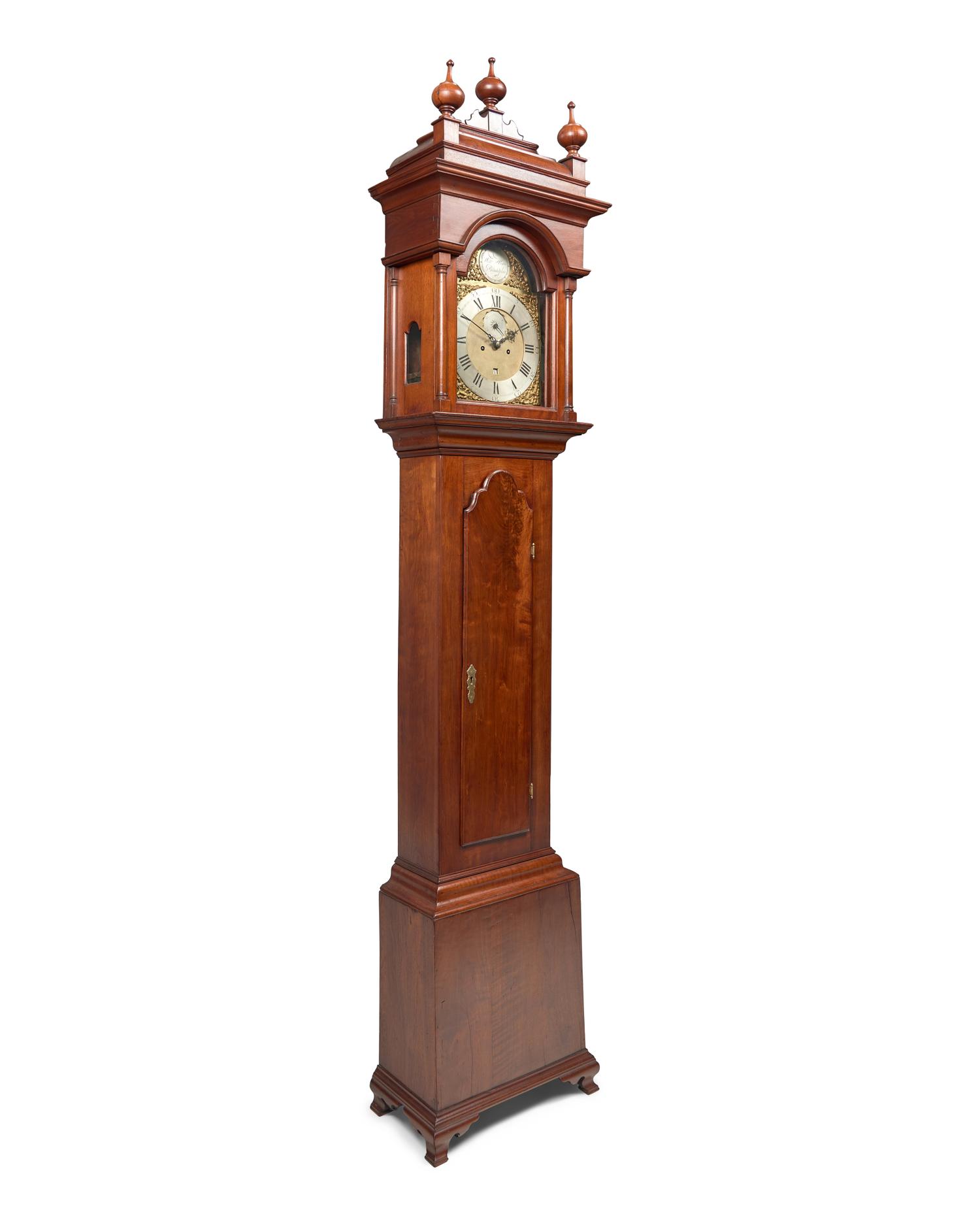 A Fine Queen Anne Carved and Figured Walnut Eight-Day Tall Case Clock