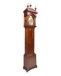 A Fine Queen Anne Carved and Figured Walnut Eight-Day Tall Case Clock