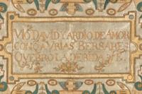 An Embroidered Silk Panel with Latin Script