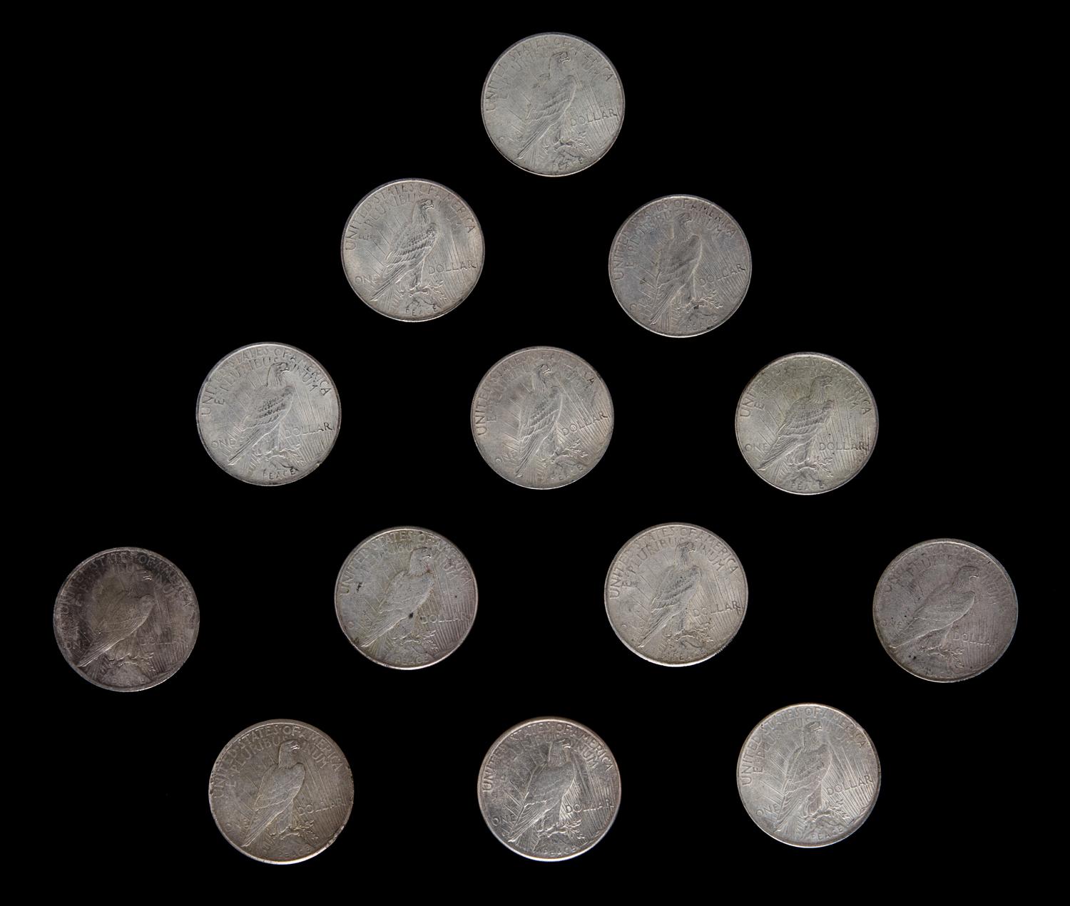 A Group of Thirteen United States Peace Silver Dollar Coins