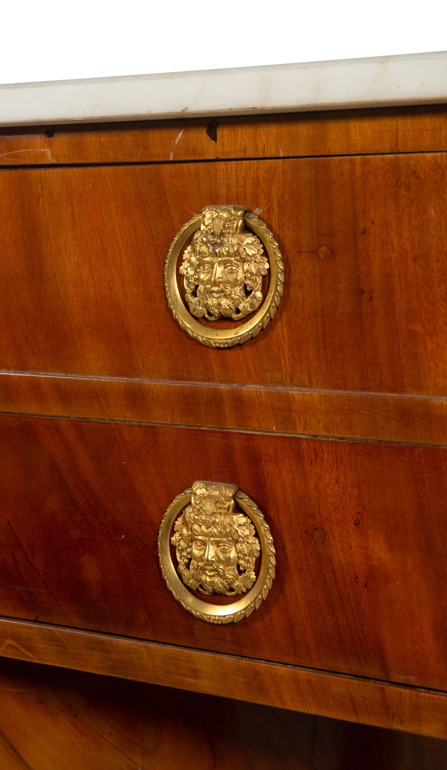 A Russian or Baltic Neoclassical Parcel Ebonized and Gilt Bronze Mounted Mahogany Marble-Top Cabinet