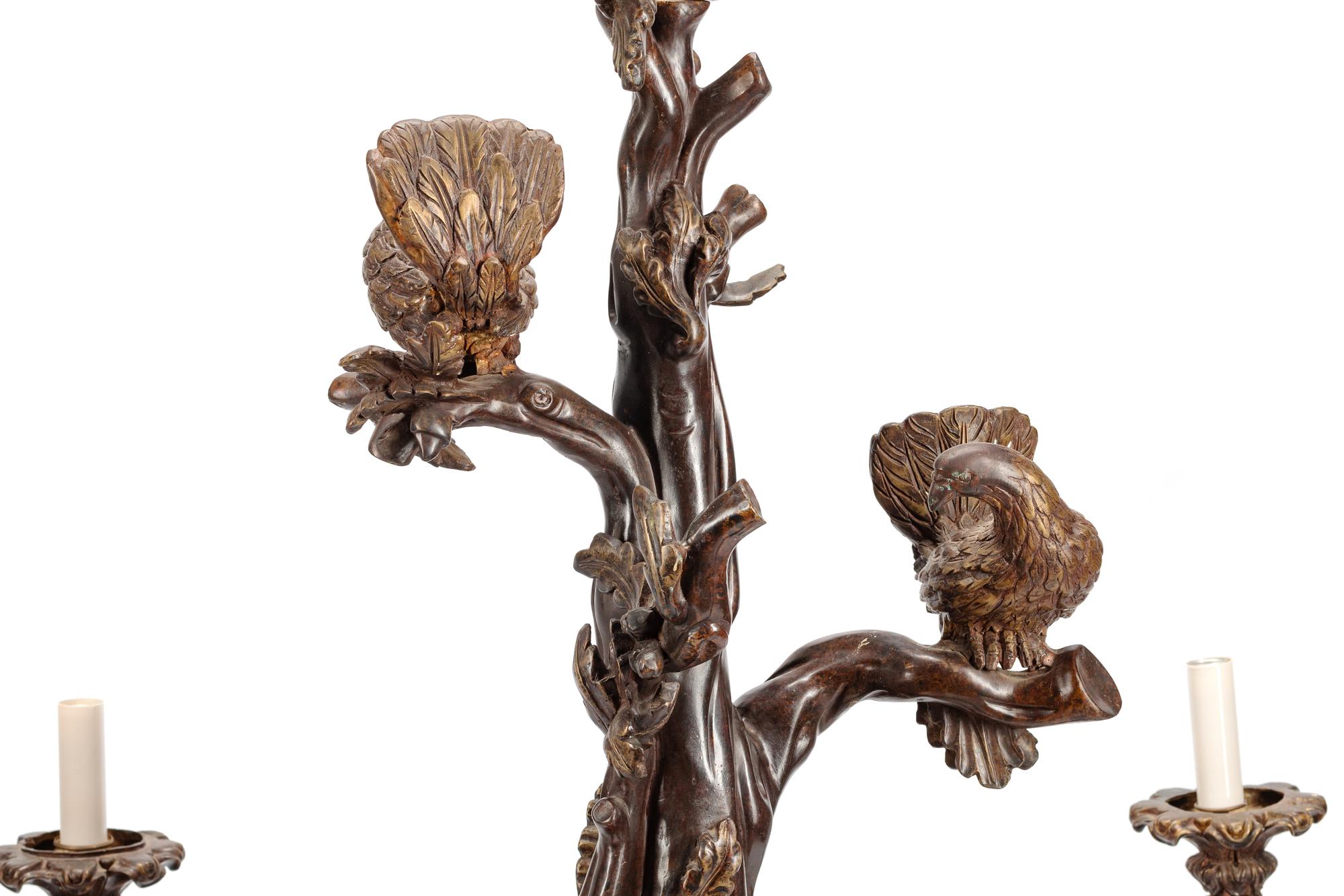 A Black Forest Style Patinated Bronze Chandelier