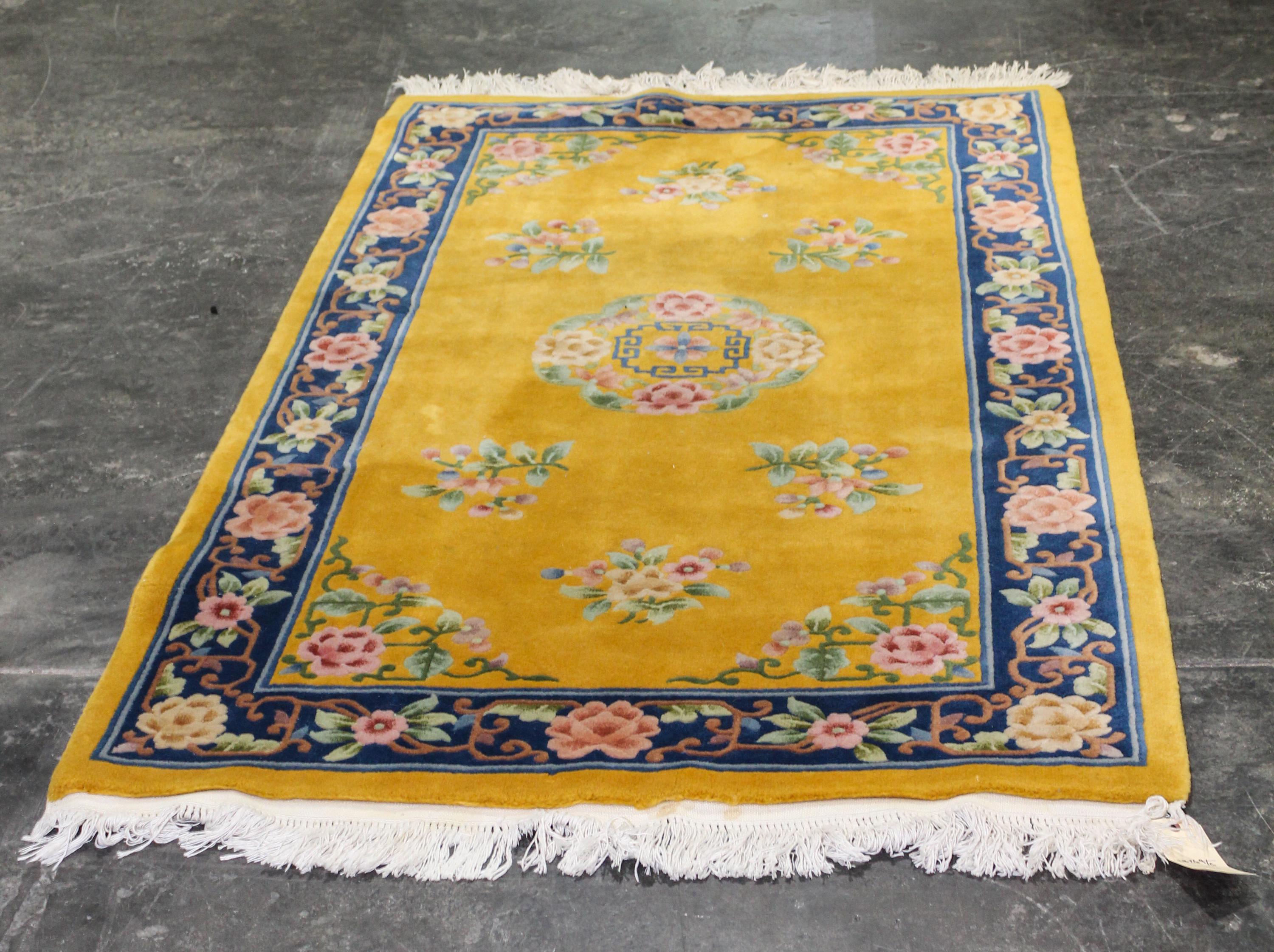 A Chinese Art Deco Style Rug. 2 feet 10 inches x 4 feet.