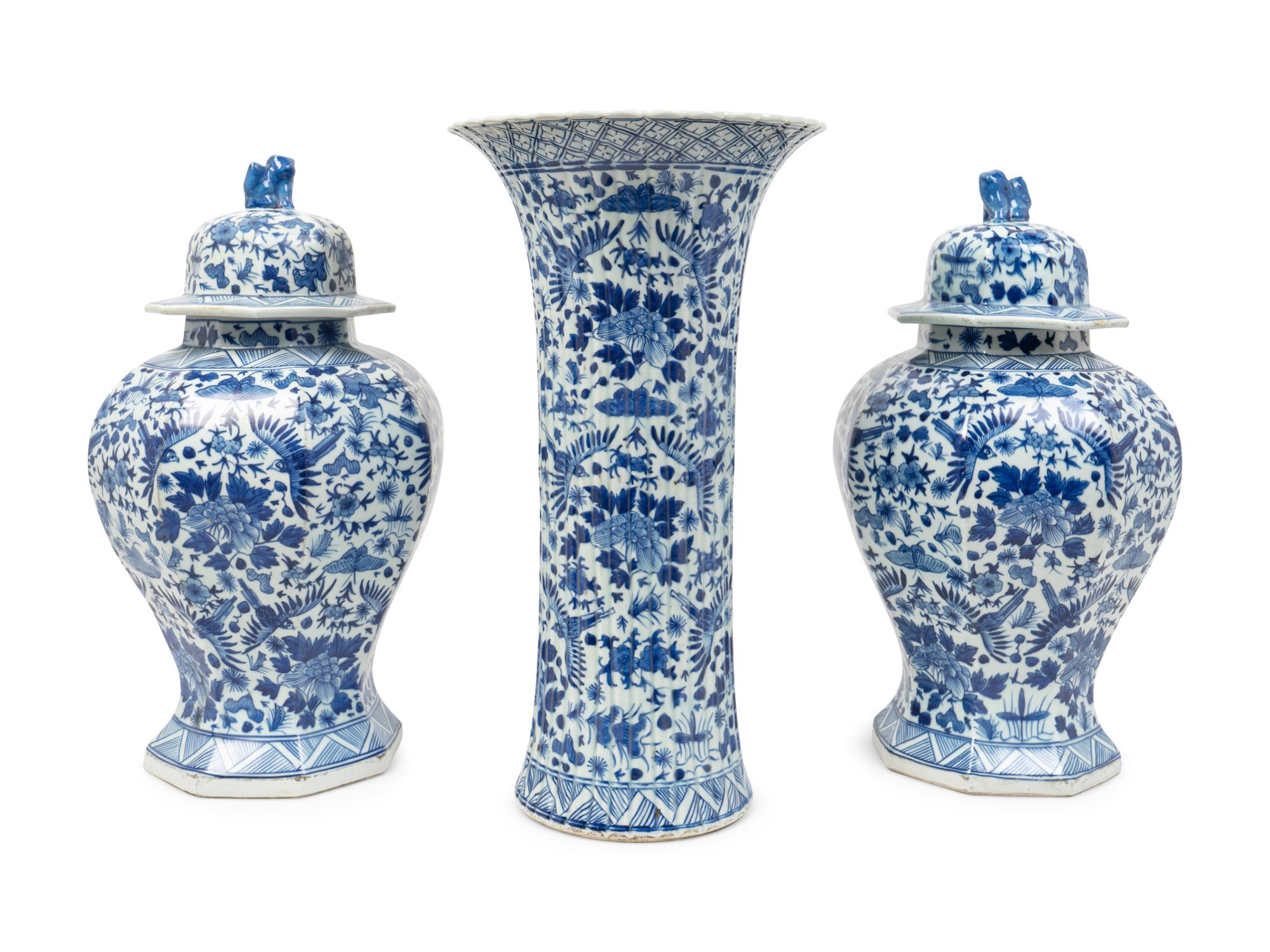 A Chinese Blue and White Porcelain Three-Piece Garniture and a Delft Fluted Vase — 20TH CENTURY