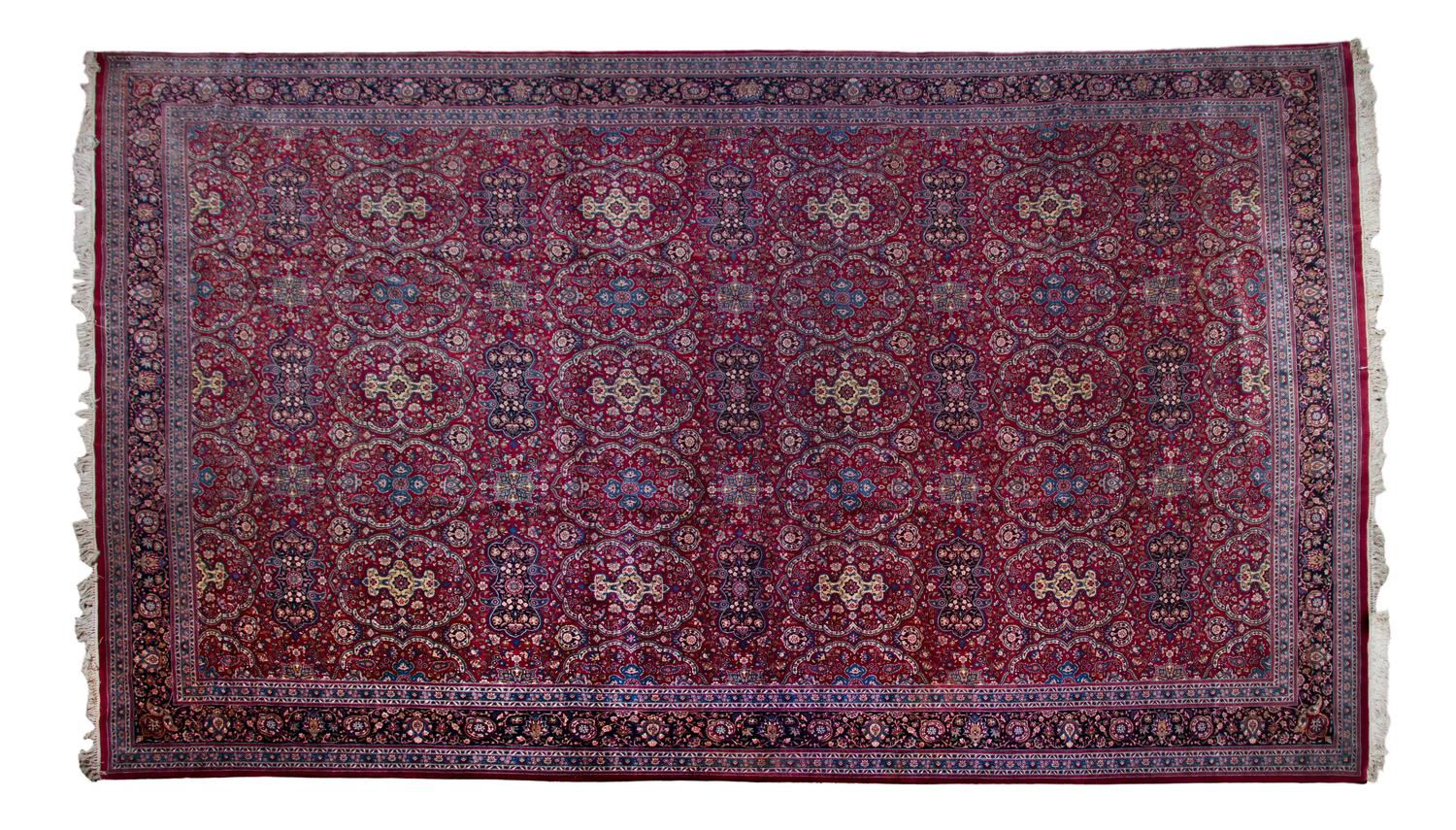 A Kashan Wool Rug, 18 feet 8 inches x 12 feet.