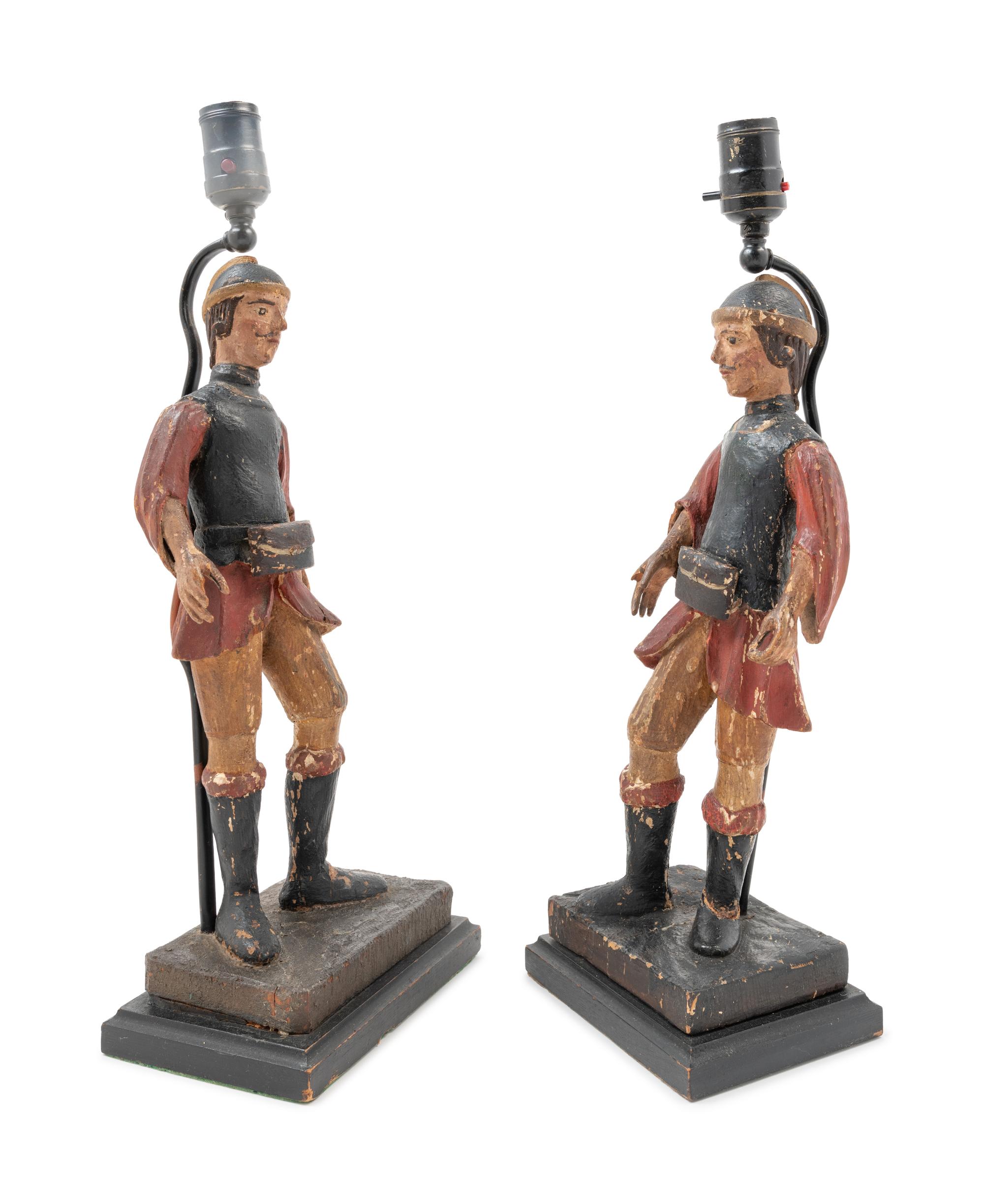 A Pair of Spanish Carved and Polychrome Decorated Figures