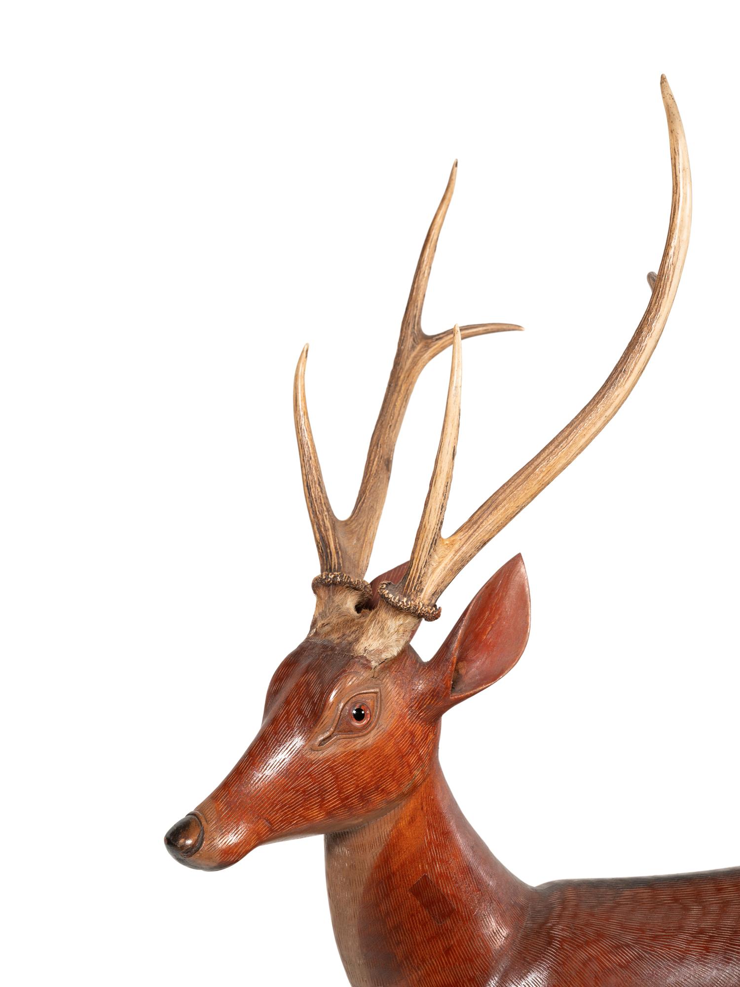 A Pair of Carved Fruitwood and Antler Mounted Models of Deer