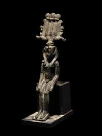 An Egyptian Bronze Seated Harpocrates
