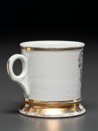 A Photographic Transfer Porcelain Shaving Mug Depicting the Arion Theatre, New York